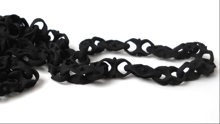 3D printed, black necklace. Necklace is made out of one piece with interlocking parts.